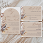 A boho wedding invitation suite that contains an invitation, RSVP and a details card. 