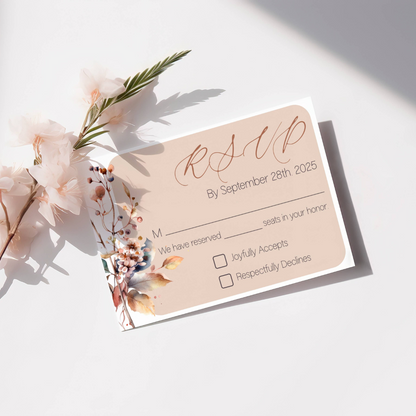 The RSVP card is similar to the details card.  It has a beige background with foliage on the left hand side.  RSVP is in capital cursive letters on the top right hand side.  It has a place to put how many seats you reserved for that person and they can either check that they joyfully accepts or respectfully declines. 